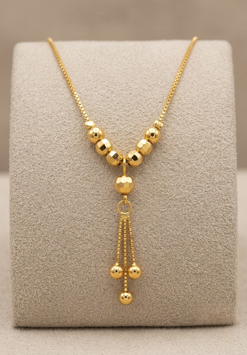 Sleek Gold Tone Lariat Drop Necklace